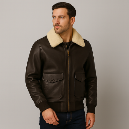 Man wearing a brown leather jacket with cream fur collar against a gray background
